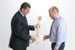 Chiropractors Bethel Park PA Jerry and Gerald Marcinak holding spine model